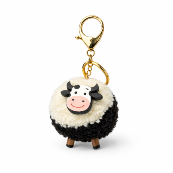 Cute-cow-plush-keychain-on-white-background